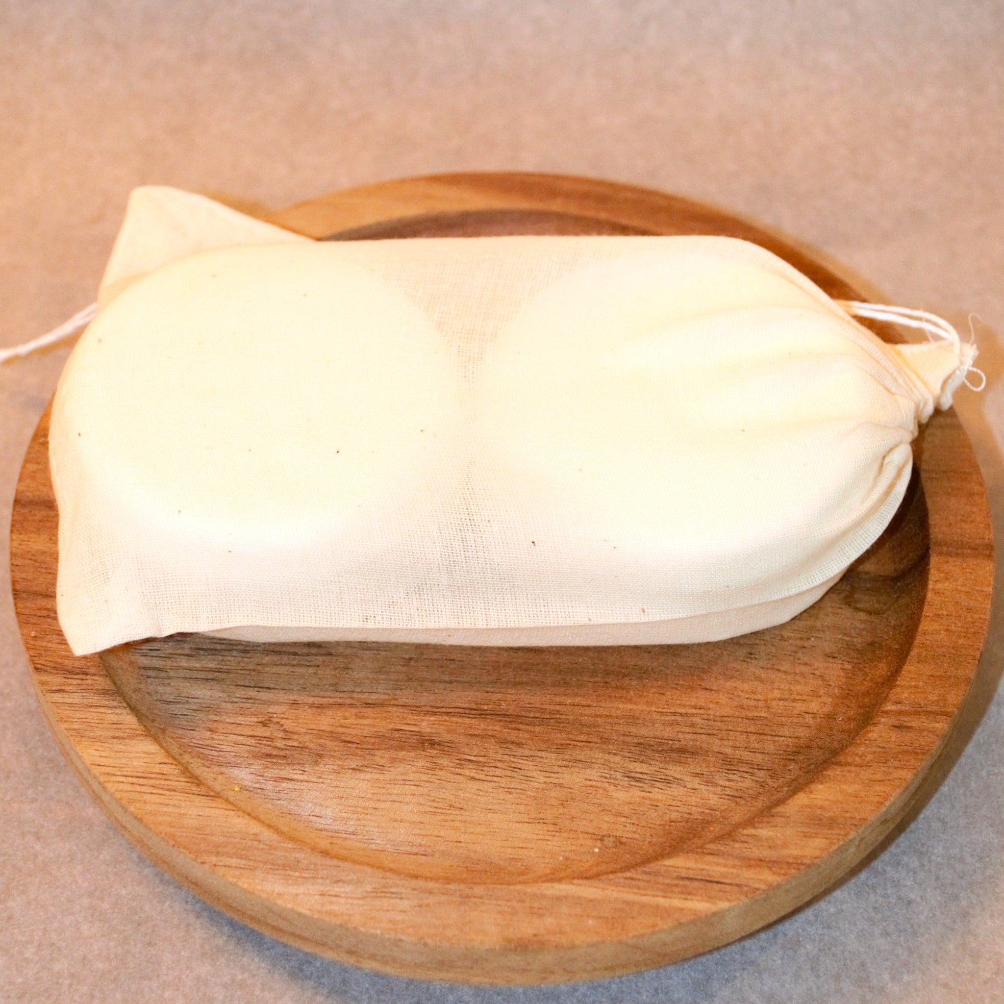 White muslin bag containing two, 2.5 ounce shower steamers